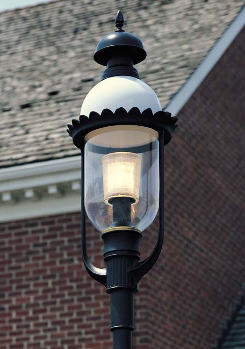 Providence 1630RLED-BLK-OP-81 post top lighting fixture in front of bank.