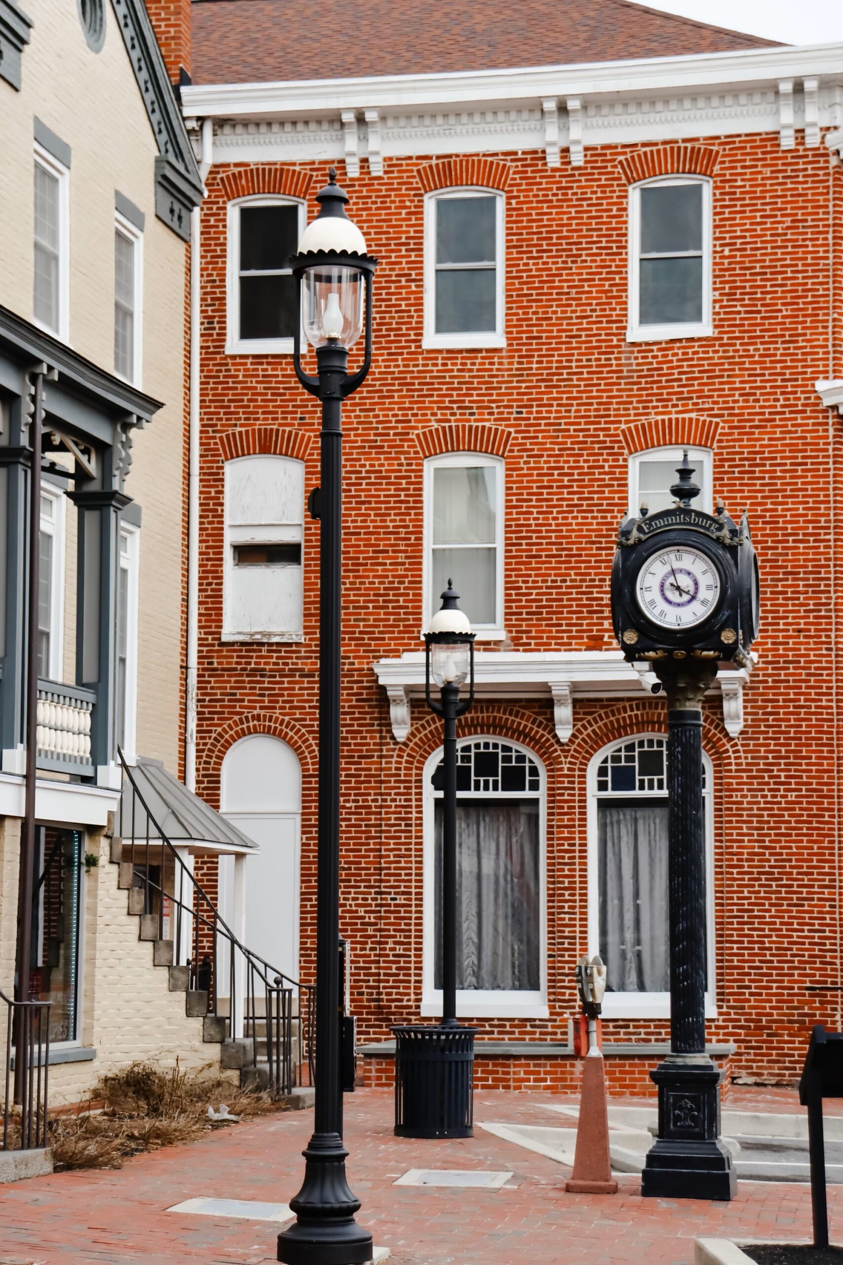 Providence 1630RLED-Emmitsburg MD post top light with clock in back ground.