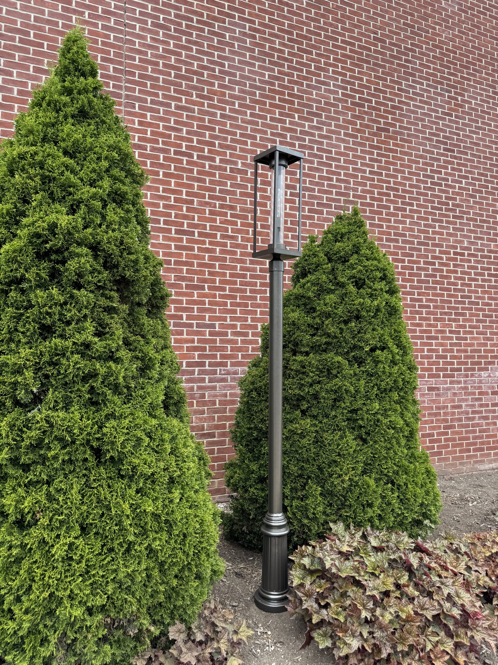 Sutton Bay B59430-HBZ-CT-MED post top lighting fixture on pole.